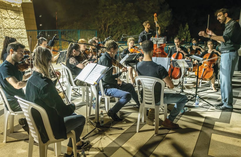  JERUSALEM STREET Orchestra members perform at the community center. (photo credit: SASSON TIRAM)