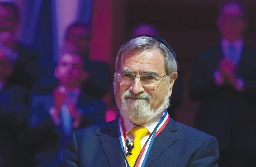  BRITISH CHIEF rabbi Lord Jonathan Sacks is honored at the 2016 Templeton Prize ceremony. Most of the translation was completed by Sacks, though an esteemed committee finished portions after his passing. (photo credit: Catholic Church England Wales/Flickr)