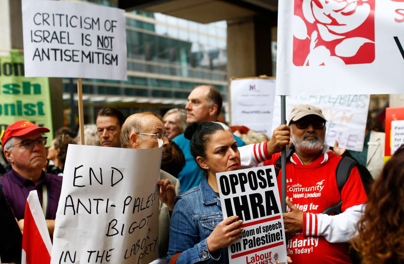  Demonstrators take part in protests outside a meeting of the National Executive of Britain's Labour Party which will discuss the party's definition of antisemitism, in London, September 4, 2018 (photo credit: REUTERS/HENRY NICHOLLS)