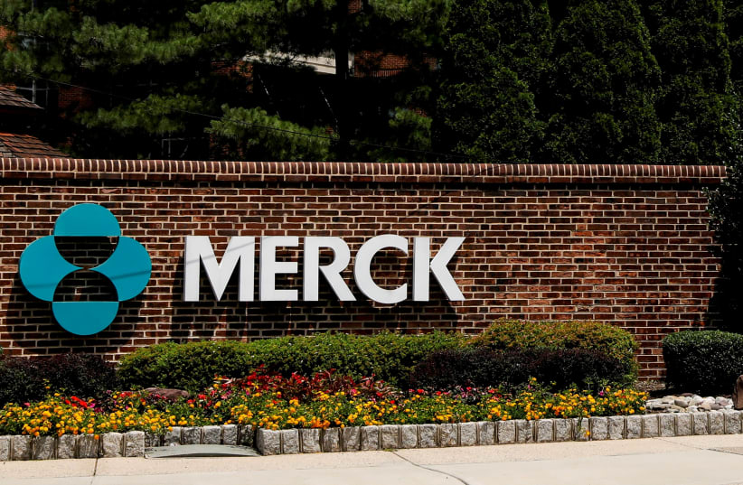  The Merck logo is seen at a gate to the Merck & Co campus in Rahway, New Jersey, US, July 12, 2018.  (photo credit: REUTERS/BRENDAN MCDERMID)