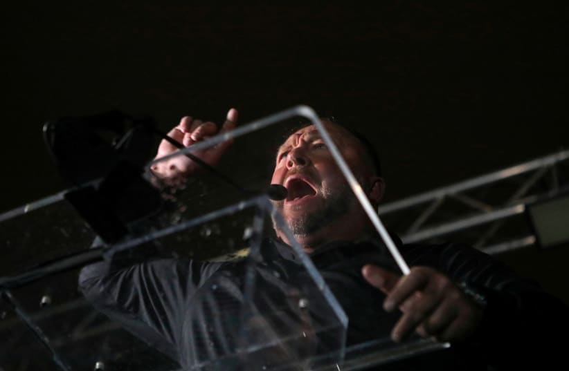  Right-wing radio talk show host Alex Jones speaks during a rally at Freedom Plaza, ahead of the U.S. Congress certification of the November 2020 election results, during protests in Washington, US, January 5, 2021 (photo credit: REUTERS/JIM URQUHART)