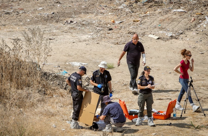  Police at the scene where the body of 17-year-old Lital Yael Melnik was found on a construction site in Kiryat Motzkin, October 2, 2021. (photo credit: ALON NADAV/FLASH 90)