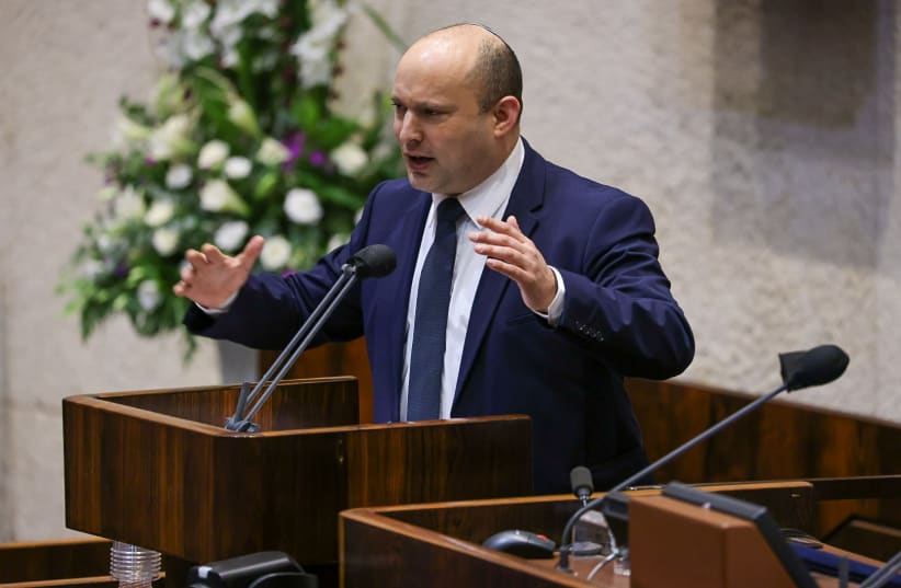 Prime Minister Naftali Bennett speaking in the Knesset plenum on October 4, 2021. (photo credit: NOAM MOSKOVICH)