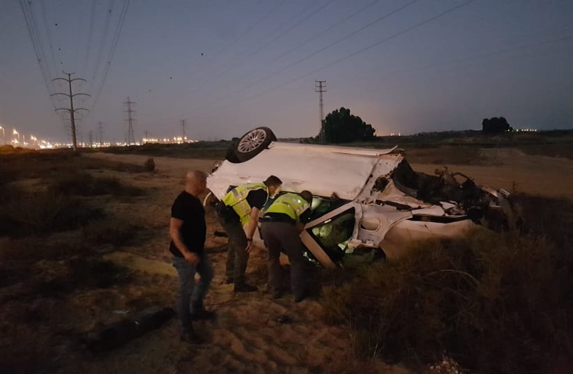  A crashed car is seen after the deadly accident on Highway 4 on October 10, 2021. (photo credit: ISRAEL POLICE)