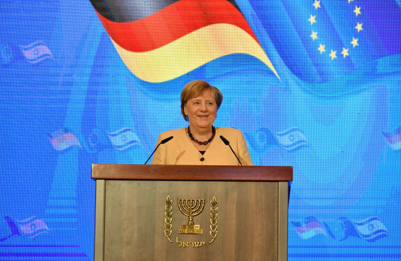  Israeli Prime Minister Naftali Bennett and outgoing German Chancellor Angela Merkel in Jerusalem, October 10, 2021. (photo credit: YOAV DAVIDKOVITZ / POOL)
