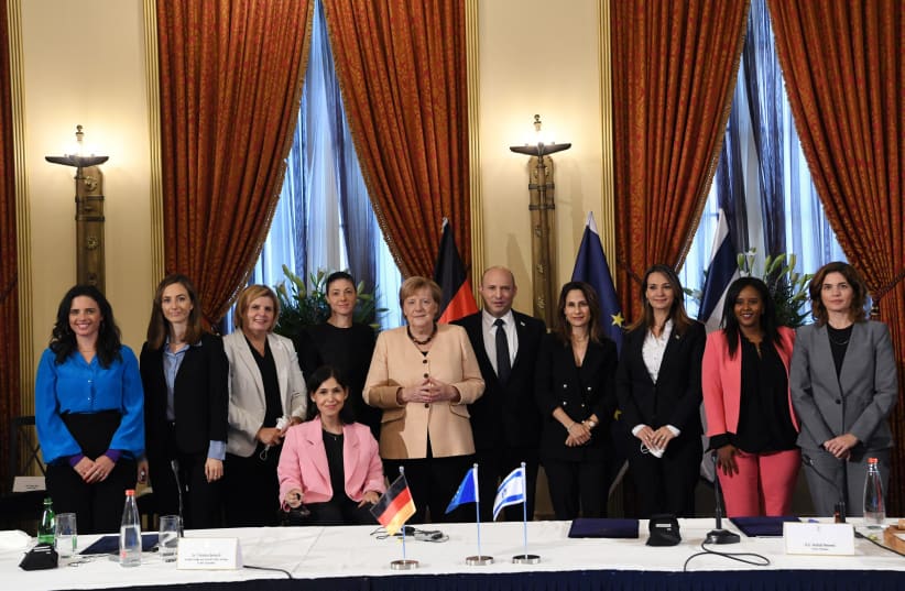  Chancellor Angela Merkel and Prime Minister Naftali Bennett posing with all of Israel's female ministers in the 36th government. (photo credit: AMOS BEN-GERSHOM/GPO)
