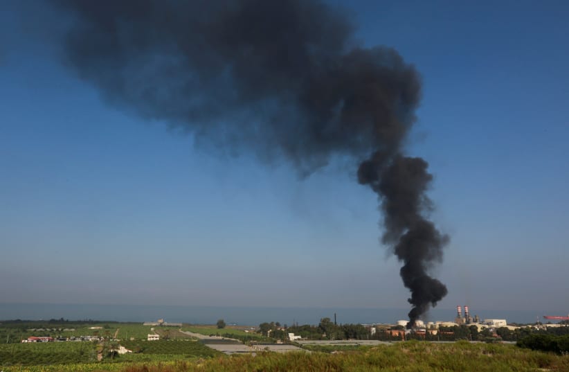  Smoke billows from a fire at the Zahrani oil facility in southern Lebanon, October 11, 2021. (photo credit: AZIZ TAHER/REUTERS)