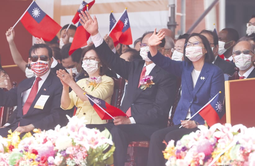 TAIWAN'S PRESIDENT Tsai Ing-Wen (second right) attends a National Day celebration in Taipei on Sunday. (photo credit: ANN WANG/REUTERS)