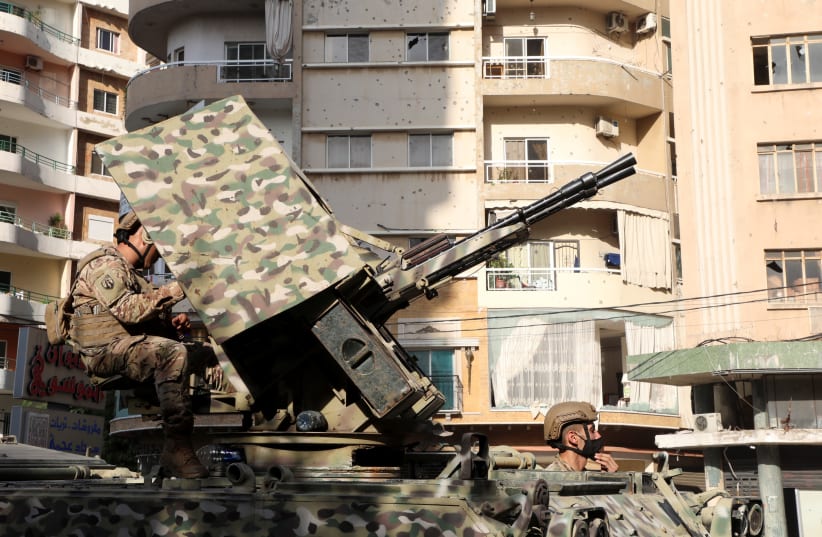  Army soldiers patrol after gunfire erupted, in Beirut, Lebanon October 14, 2021. (photo credit: REUTERS/MOHAMED AZAKIR)