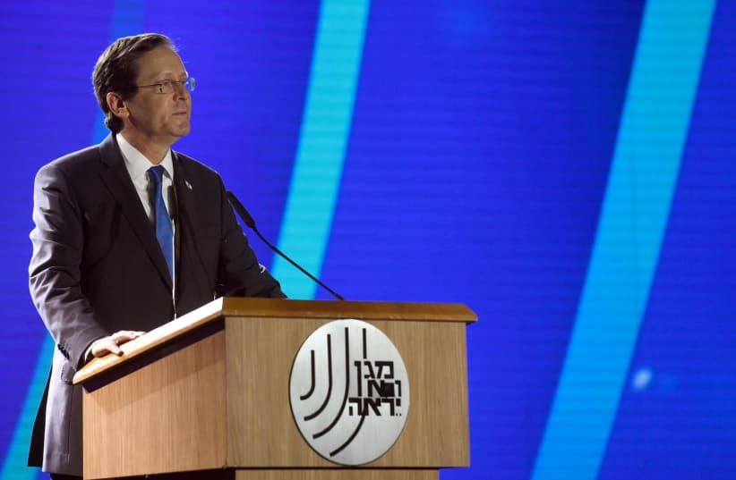  President Isaac Herzog speaks at the ceremony in honor of outgoing leader of the Shin Bet, Nadav Argaman. (photo credit: CHAIM TZACH/GPO, SHIN BET)