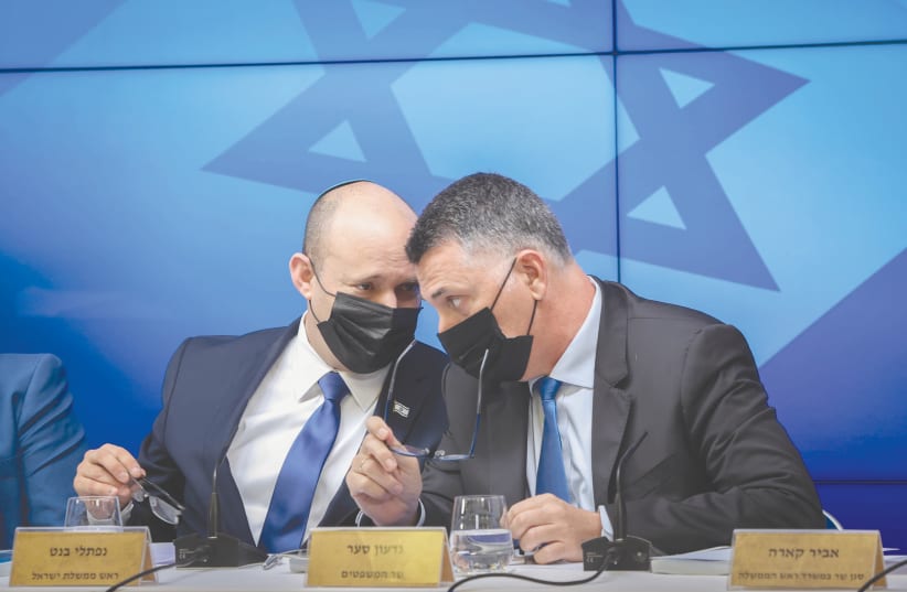  PRIME MINISTER Naftali Bennett and Justice Minister Gideon Sa’ar participate in a press conference in Jerusalem in July. (photo credit: AMIT SHABI/POOL)