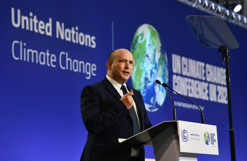  Prime Minister Naftali Bennett speaking at the COP26 climate conference in Glasgow, November 1, 2021.  (photo credit: CHAIM TZACH/GPO)