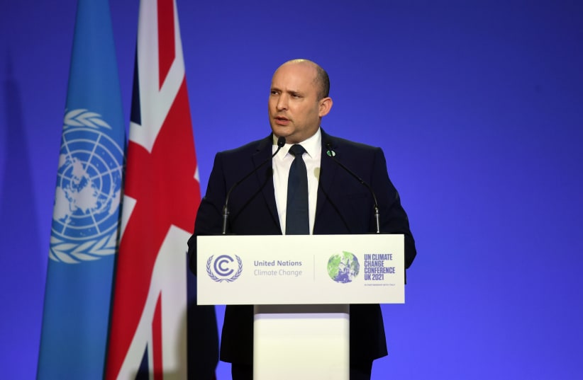  Prime Minister Naftali Bennett speaking at the COP26 climate conference in Glasgow, November 1, 2021.  (photo credit: CHAIM TZACH/GPO)