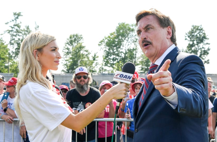 MyPillow CEO Mike Lindell is interviewed by the One America News Network during former U.S. president Donald Trump's rally at the Lorain County Fairgrounds in Wellington, Ohio, US, June 26, 2021. (photo credit: REUTERS/GAELEN MORSE/FILE PHOTO)