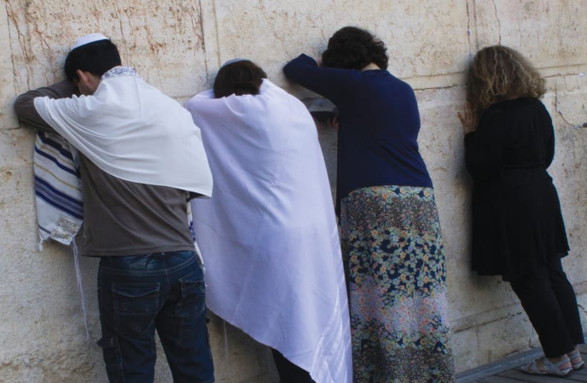  PRAYING AT Robinson’s Arch at the south end of  the Kotel, the section set aside for pluralistic prayer.  (photo credit: ROBERT SWIFT/FLASH90)