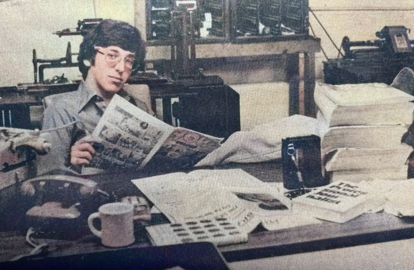  THE WRITER at the newspaper he  worked at during and after high  school.  (photo credit: BRIAN BLUM)