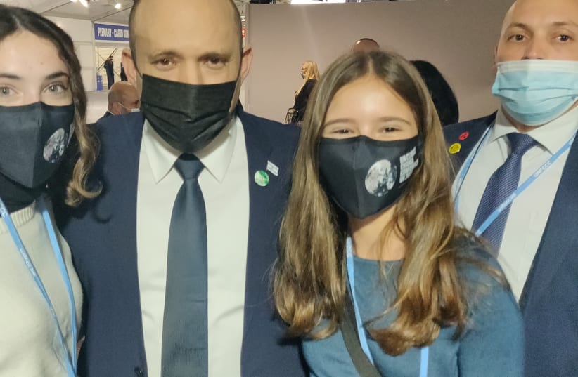  PRIME MINISTER Naftali Bennett poses with Alma Pomagrin, 15, and Lia Lev, 16, activists from the Strike4Climate group, in Glasgow last week. (photo credit: YOSEF ABRAMOWITZ)