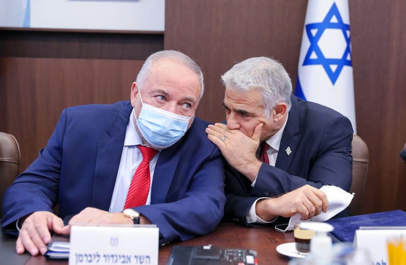  Foreign Minister Yair Lapid and Finance Minister Avigdor Liberman at the cabinet meeting, November 7, 2021.  (photo credit: MARC ISRAEL SELLEM/THE JERUSALEM POST)
