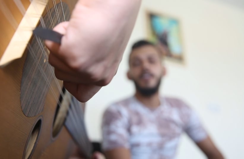  The Kayan Cultural Center, with the help of its psychological counseling unit, is combining traditional psychiatric treatment with music therapy for Gazans suffering from traumatic distress. (photo credit: Courtesy)