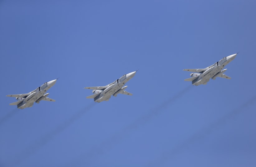 Tupolev Tu-22M3 Backfire strategic bombers fly in formation over the Red Square during the Victory Day parade in Moscow, Russia, May 9, 2015. (photo credit: REUTERS/HOST PHOTO AGENCY/RIA NOVOSTI)