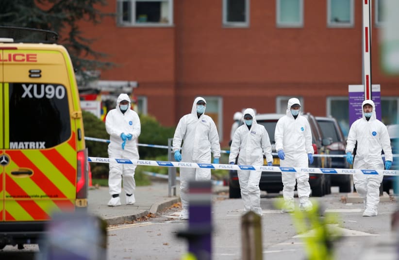  Forensic officers work outside Liverpool Women's Hospital, following a car blast, in Liverpool, Britain, November 15, 2021 (photo credit: REUTERS/ED SYKES)