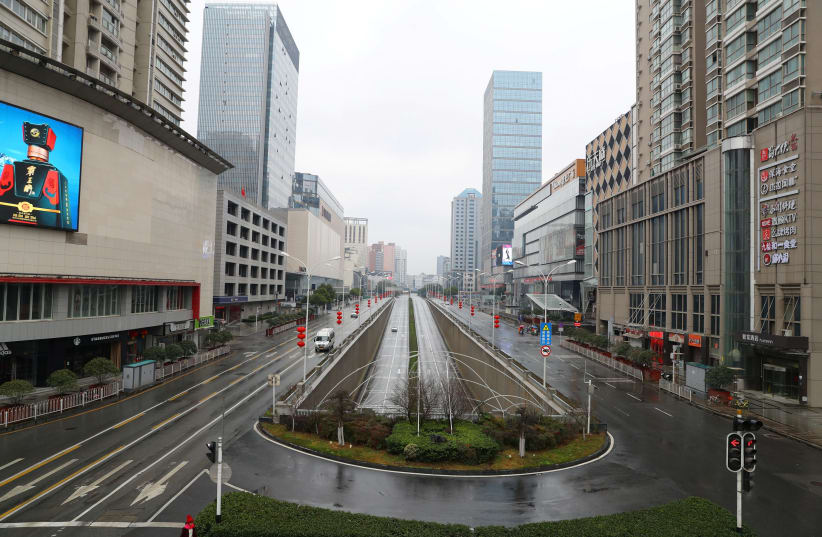  Street view after Wuhan government announced to ban non-essential vehicles in downtown area to contain coronavirus outbreak, on the second day of the Chinese Lunar New Year, in Wuhan, Hubei province, China January 26, 2020.  (photo credit: CNSPHOTO VIA REUTERS)