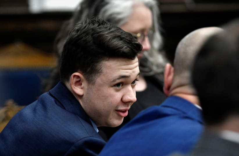  Kyle Rittenhouse speaks with his attorneys before the jury is relieved for the evening during his trial at the Kenosha County Courthouse in Kenosha, US, November 18, 2021. (photo credit: SEAN KRAJACIC/POOL VIA REUTERS)