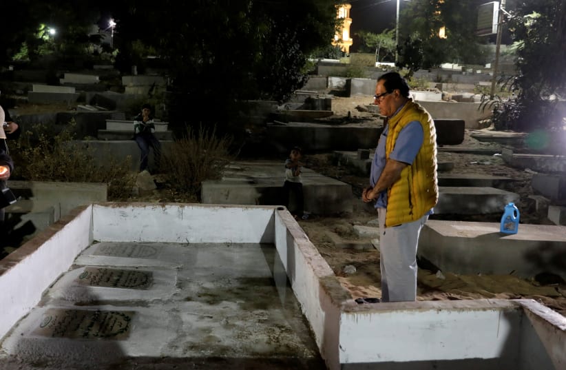  Izzeldin Abuelaish, a Palestinian doctor visits the graves of his 3 daughters who were killed during the 2009 war in Gaza, at a cemetery in northern Gaza Strip. (photo credit: MOHAMMED SALEM/REUTERS)