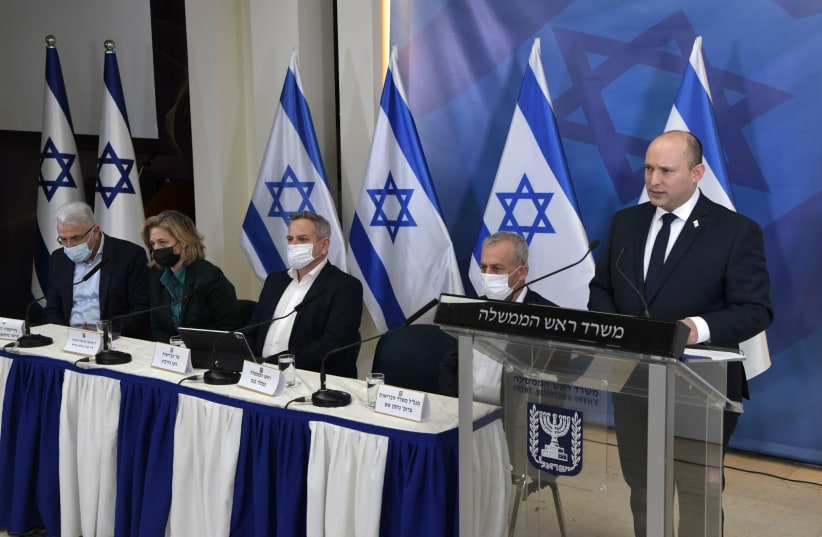  Prime Minister Naftali Bennett speaking in a press conference on the new COVID variant discovered in South Africa on Friday, November 26, 2021 (photo credit: KOBI GIDEON/GPO)