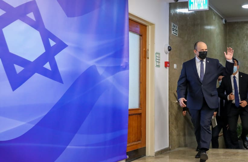  Prime Minister Naftali Bennett arrives to a cabinet meeting at the Prime Minister's office in Jerusalem on November 28, 2021. (photo credit: MARC ISRAEL SELLEM/POOL)