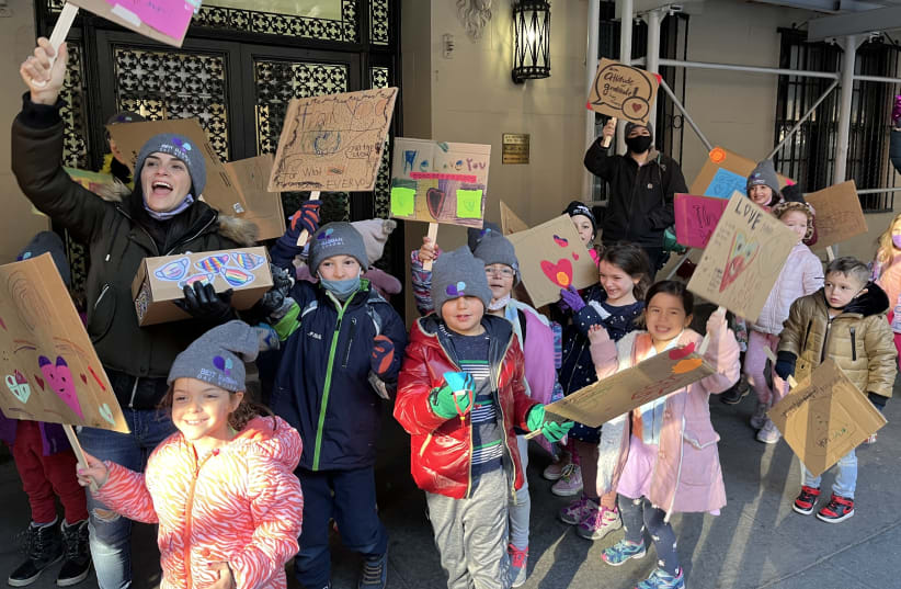  Students and parents from Beit Rabban Day School in Manhattan march to express their gratitude to neighborhood workers on the Upper West Side on the eve of Thanksgiving, Nov. 24, 2021.  (photo credit: COURTESY BEIT RABBAN)
