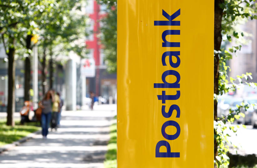  A Postbank sign is seen in Munich, Germany, August 1, 2017. (photo credit: REUTERS/MICHAELA REHLE)