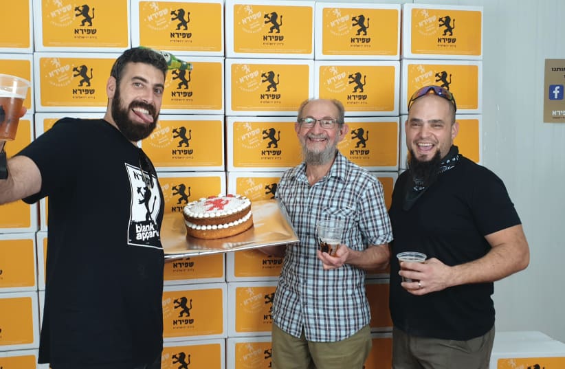  A birthday cake for a decade! The writer (center) joins Itzik Shapiro (left), CEO of the brewery, and chief brewer Ory Sofer (photo credit: Courtesy)