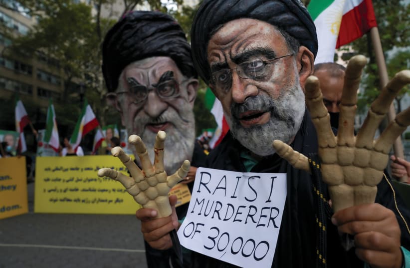  IRANIAN AMERICANS rally against Ebrahim Raisi outside UN headquarters in New York, during the opening of the General Assembly in September. (photo credit: REUTERS/DAVID 'DEE' DELGADO)