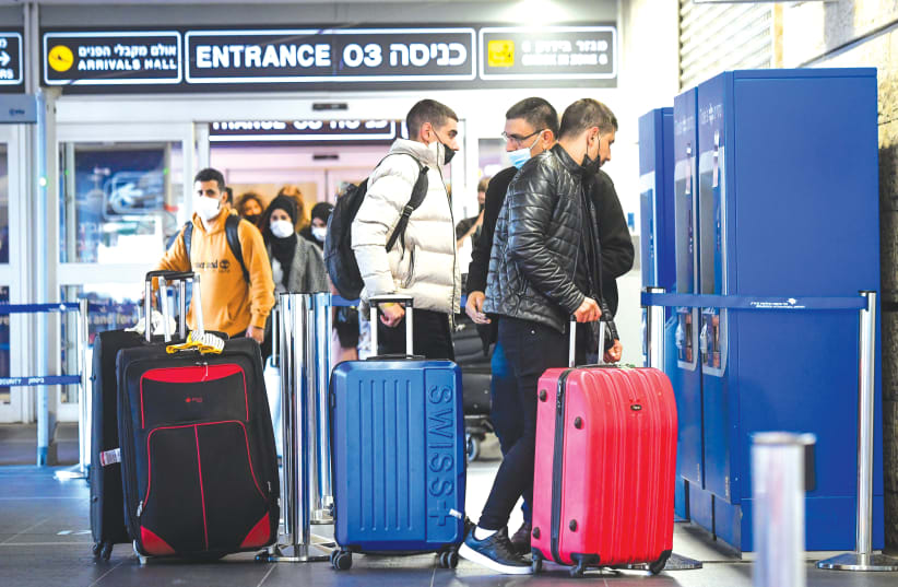  TRAVELERS AT Ben-Gurion Airport this week. (photo credit: AVSHALOM SASSONI/FLASH90)