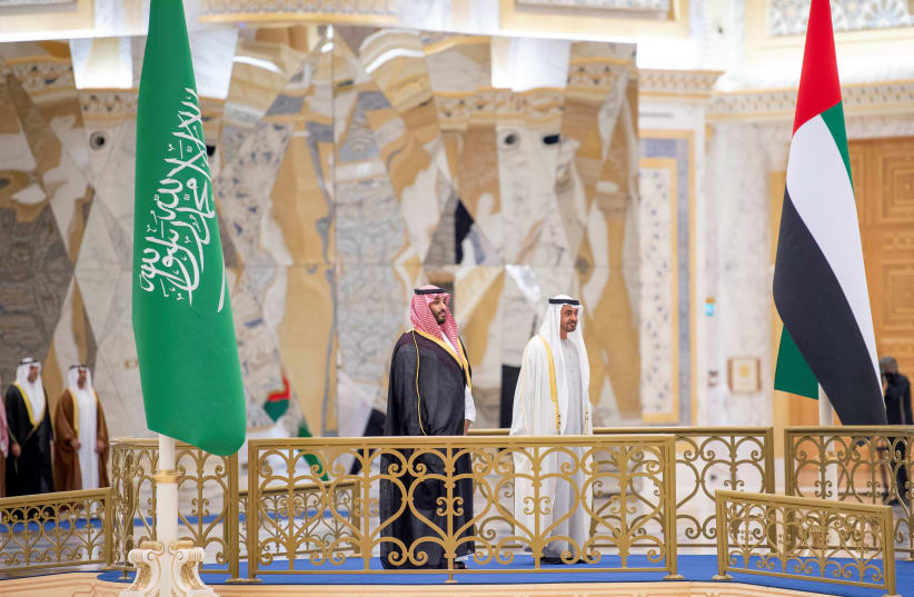  Abu Dhabi Crown Prince Sheikh Mohammed bin Zayed al-Nahyan receives Saudi Crown Prince, Mohammed bin Salman in Abu Dhabi, United Arab Emirates December 7, 2021. (photo credit: BANDAR ALGALOUD / SAUDI ROYAL COURT / REUTERS)