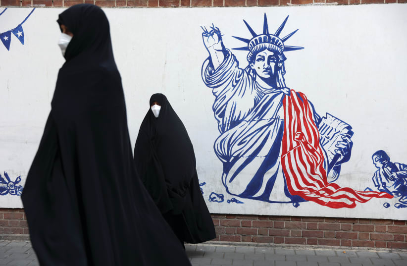  DEMONSTRATORS STAND in front of anti-American murals on a wall of the former US embassy in Tehran last month, during an event commemorating the ‘US expulsion’ from Iran. (photo credit: MAJID ASGARIPOUR/WANA (WEST ASIA NEWS AGENCY) VIA REUTERS)