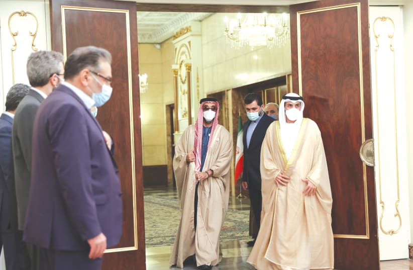  UAE NATIONAL Security Adviser Sheikh Tahnoon bin Zayed Al Nahyan (center, with red keffiyeh) arrives to meet with Iran’s President Ebrahim Raisi in Tehran, earlier this week. (photo credit: MAJID ASGARIPOUR/WANA/REUTERS)