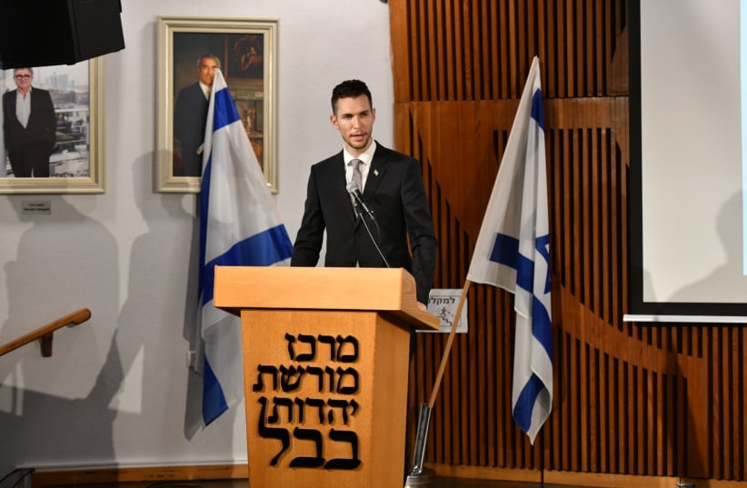 Deputy Foreign Minister Idan Roll speaks at an event marking Jewish Refugee Day from Arab countries and Iran at the Babylonian Jewish Heritage Center in Or-Yehuda on December 8, 2021. (photo credit: SHLOMI AMSALEM/GPO)