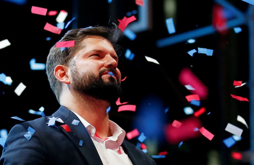  Chile's President-elect Gabriel Boric celebrates with supporters after winning the presidential election in Santiago, Chile, December 19, 2021 (photo credit: REUTERS/RODRIGO GARRIDO)