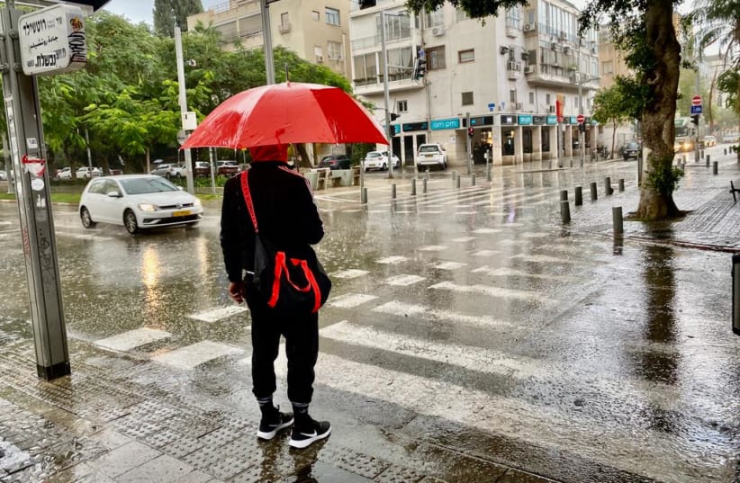Israel prepares for Storm Carmel as rain falls in Tel Aviv, December 20, 2021 (photo credit: AVSHALOM SASSONI/MAARIV)