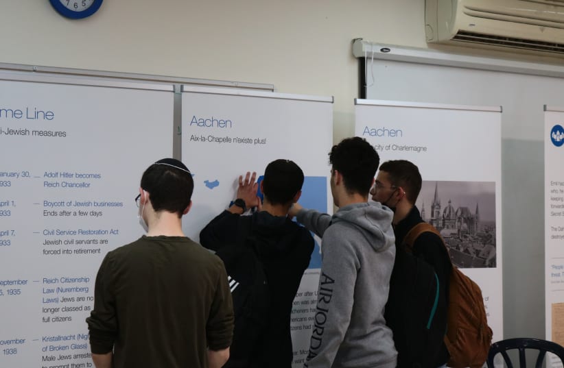  STUDENTS GET up close and personal with the exhibition at Yeshivat AMIT Amichai, Rehovot. (photo credit: MARVIN ZIEGELE)
