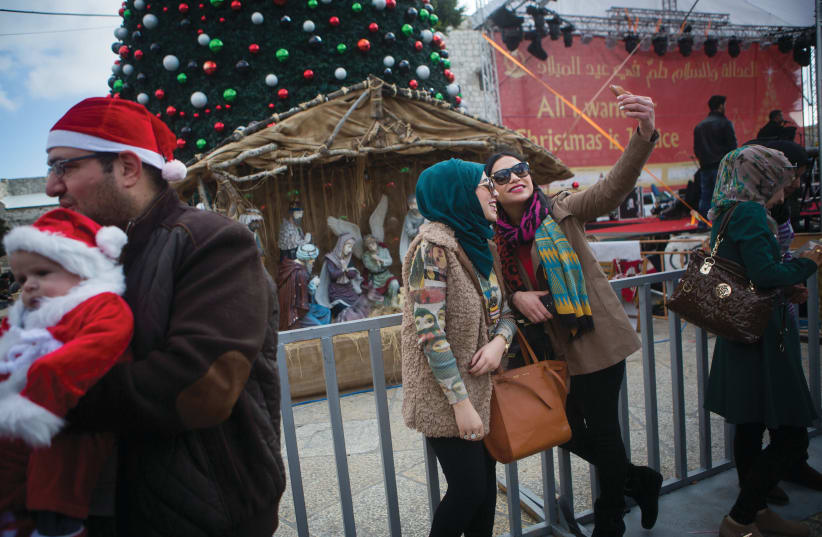  ‘I SPENT many a Christmas Eve in Bethlehem’s Manger Square’: Taking a selfie there on a previous holiday; illustrative. (photo credit: MIRIAM ALSTER/FLASH90)