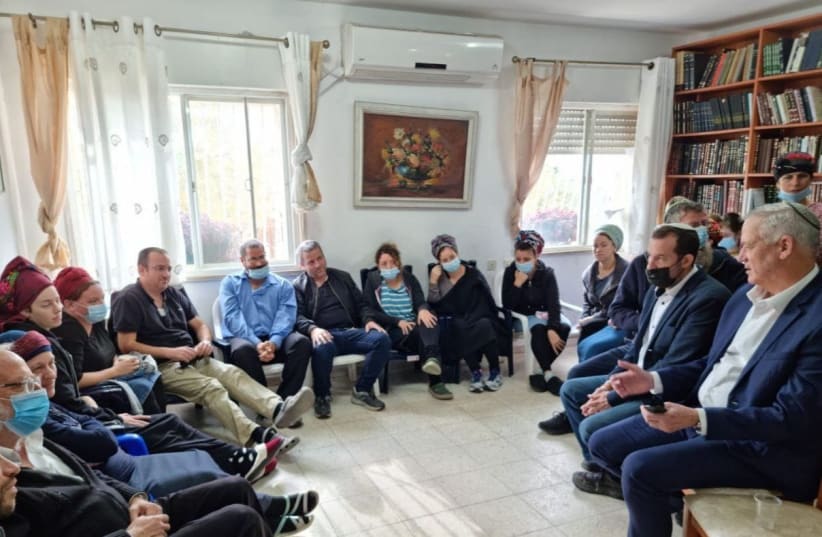  Defense Minister Benny Gantz is seen visiting the family of Yehuda Dimentman in Mevaseret Zion, where they are sitting shiva, on December 22, 2021. (photo credit: Berle Crombie )