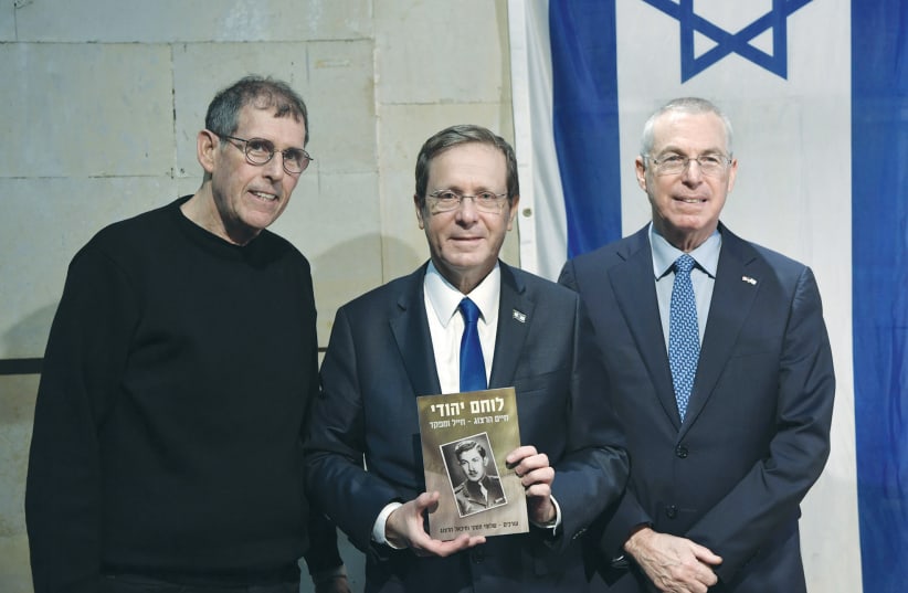  PRESIDENT ISAAC HERZOG, flanked by Yediot Publishing CEO Dov Eichenwald (left) and brother and Ambassador to the US Mike Herzog. (photo credit: KOBI GIDEON/GPO)