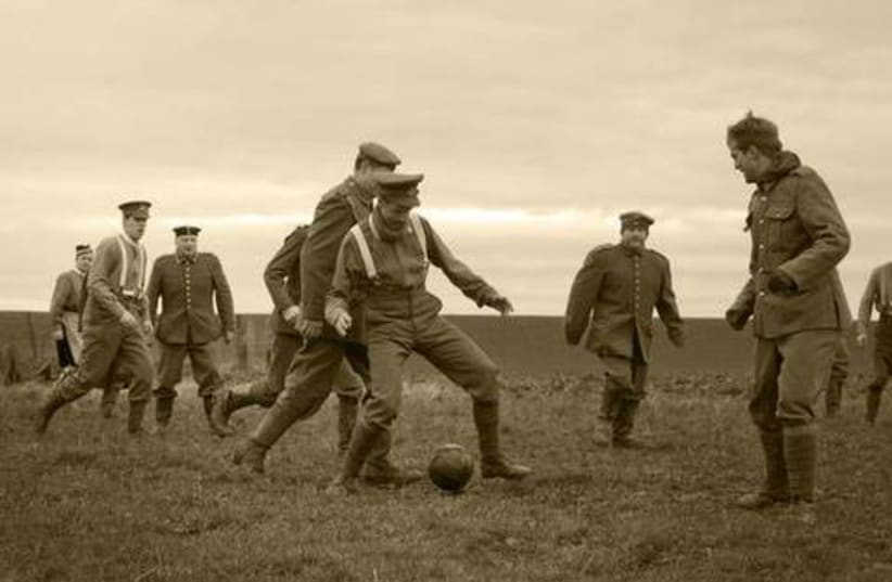  British and German soldiers play soccer together during the WWI Christmas Truce of 1914. (photo credit: Wikimedia Commons)