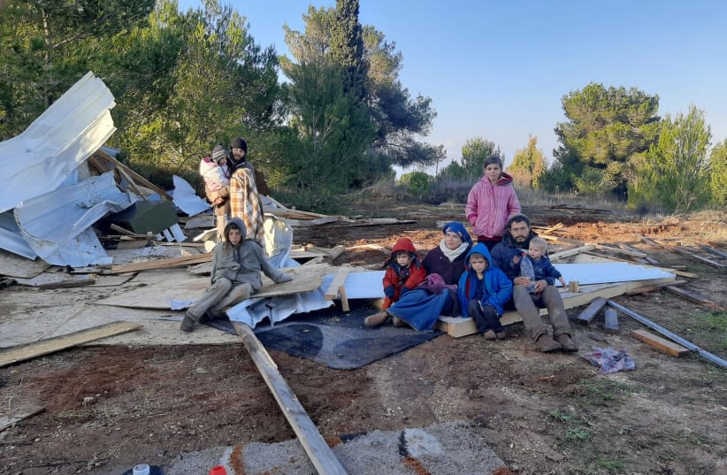  A family in the hilltop settlement of Homesh after the modular structures were taken down by police, December 24, 2021.  (photo credit: NACHALA)