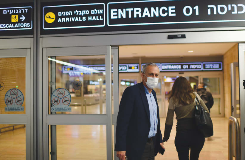 Passengers arrive at Ben-Gurion Airport earlier this year. (photo credit: TOMER NEUBERG/FLASH90)