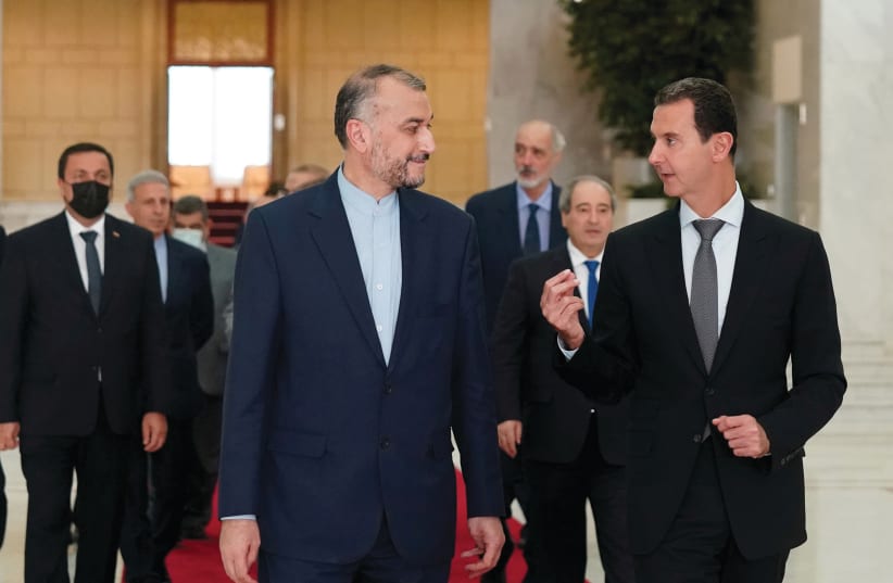  Syrian President Bashar Assad meets with Iranian foreign minister Hossein Amir Abdollahian, Damascus (photo credit: SANA/HANDOUT VIA REUTERS)