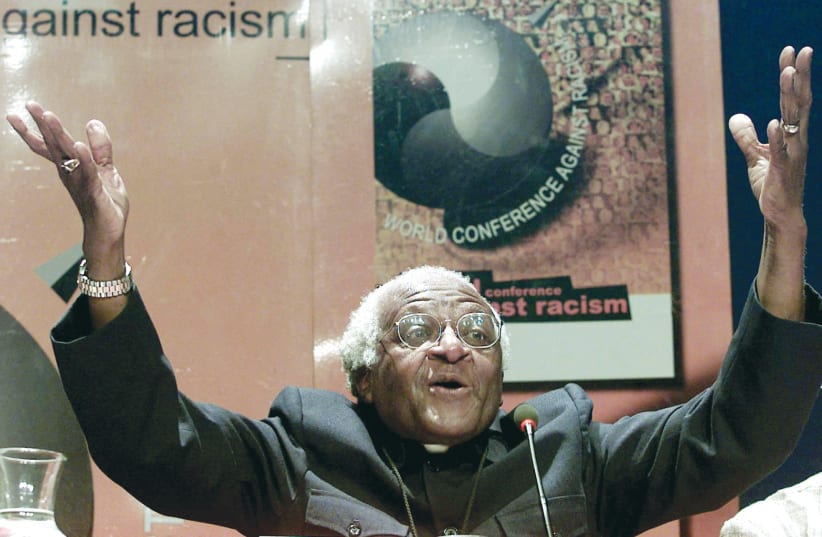  NOBEL PEACE laureate Archbishop Desmond Tutu addresses journalists at the World Conference Against Racism (WCAR) in 2001. (photo credit: Juda NgWenya/Reuters)